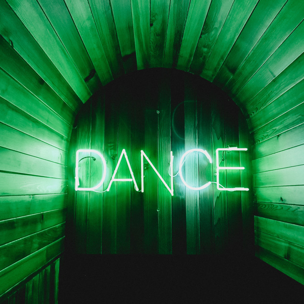 Green Neon Sign with the word "Dance"